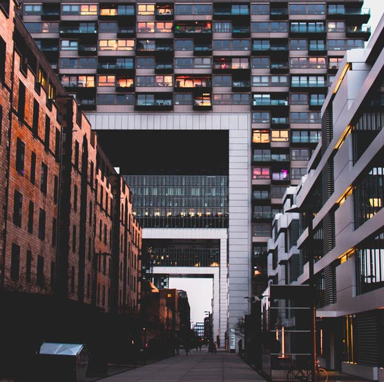 A multi-windowed building showcasing a modern architectural design with numerous glass panes on its exterior.